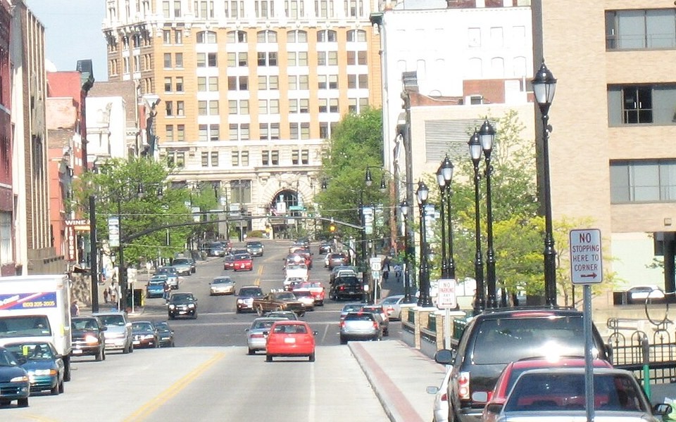 Looking east along the south side of Main Street from Front Street, May 2007. 11 Main Street is the building on that corner. Photo by Tom Vazquez, public domain.